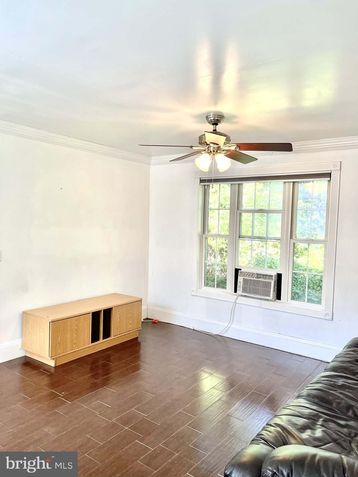 227 7th Street Colonial Beach, VA 22443 - Photo 28 of 36 a view of a livingroom with a ceiling fan and window