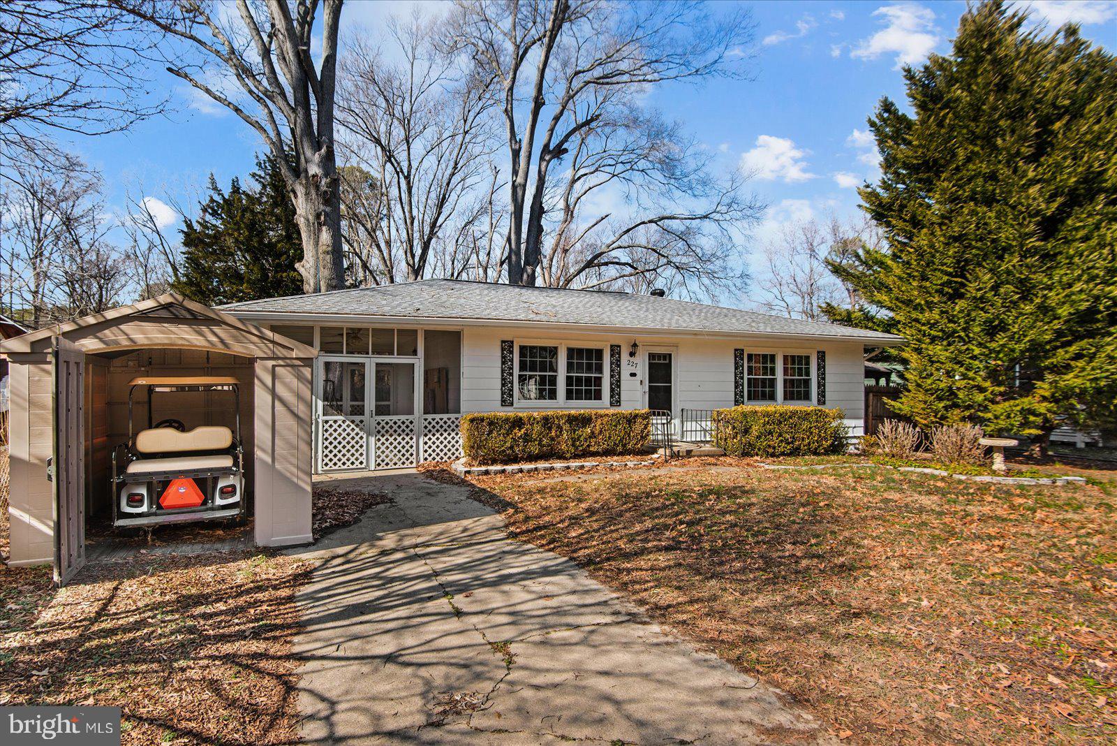 227 7th Street Colonial Beach, VA 22443 - Photo 3 of 36 a front view of a house with a yard