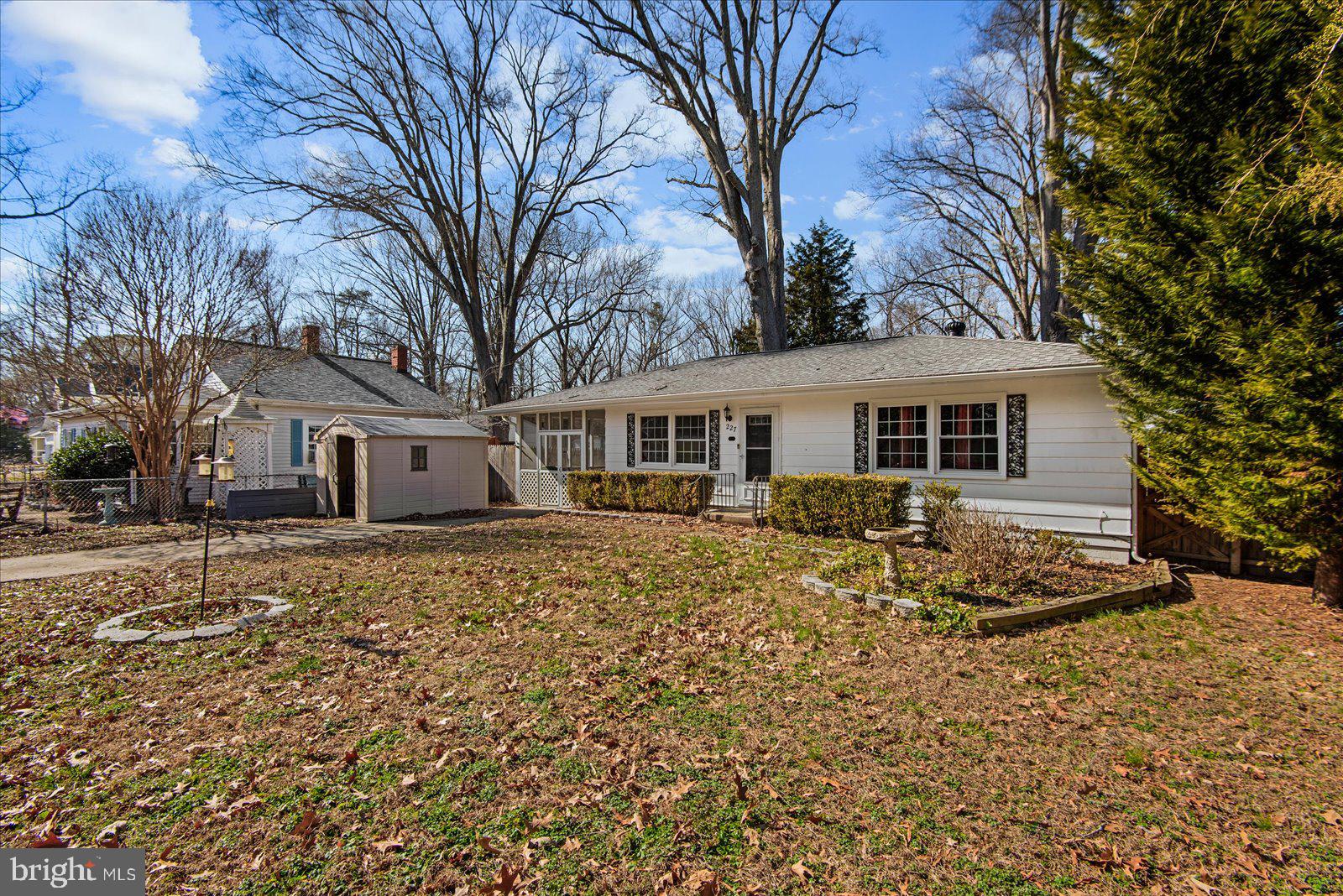 227 7th Street Colonial Beach, VA 22443 - Photo 4 of 36 a view of a yard with a house