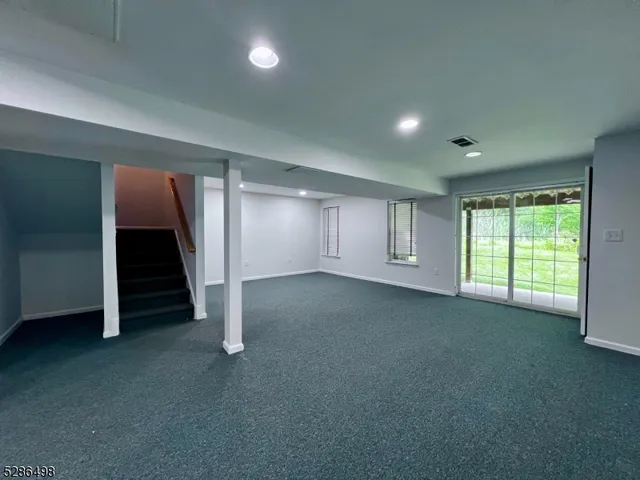 an empty room with a empty space and window