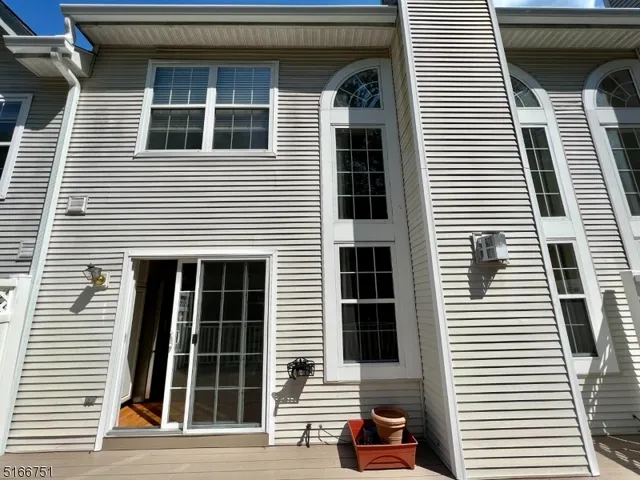 a view of a house with a door and a large window