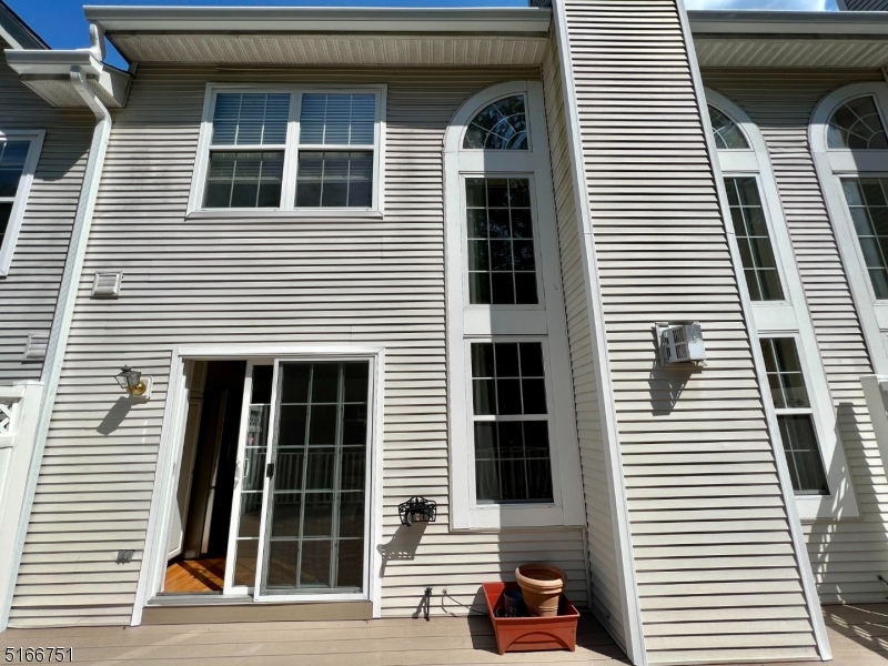 128 Constitution Way Bernards, NJ 07920 - Photo 22 of 26 a view of a house with a door and a large window