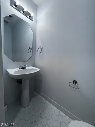 a bathroom with a sink toilet
