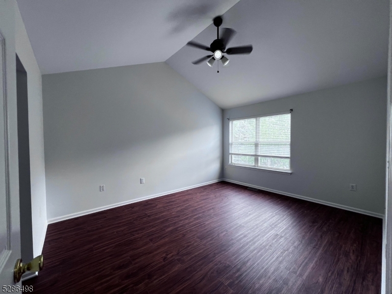 128 Constitution Way Bernards, NJ 07920 - Photo 9 of 26 a view of empty room with wooden floor and fan