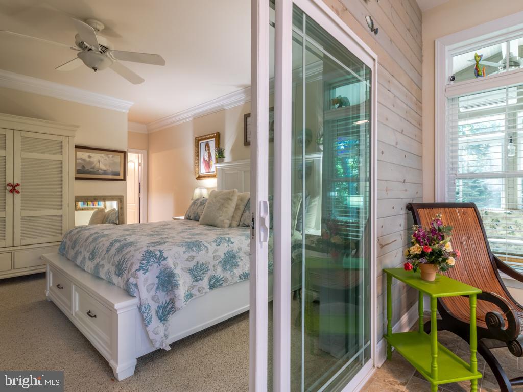 76 Radcliffe Drive Rehoboth Beach, DE 19971 - Photo 21 of 37 Sliders between Primary Bedroom and bonus sunroom