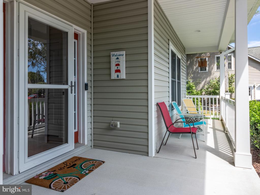 76 Radcliffe Drive Rehoboth Beach, DE 19971 - Photo 4 of 37 Space on both sides for porch furniture