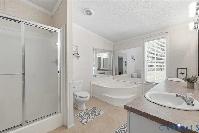 a bathroom with a granite countertop sink toilet a mirror and shower