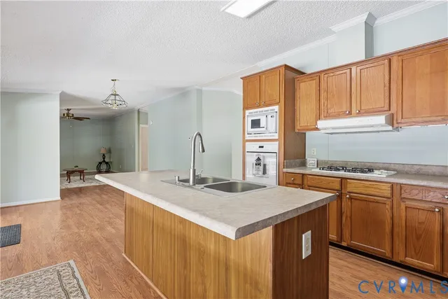 a kitchen with stainless steel appliances granite countertop a sink and cabinets