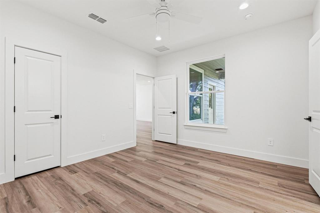 508 Florence Denison, TX 75020 - Photo 16 of 26 a view of an empty room with wooden floor and a window