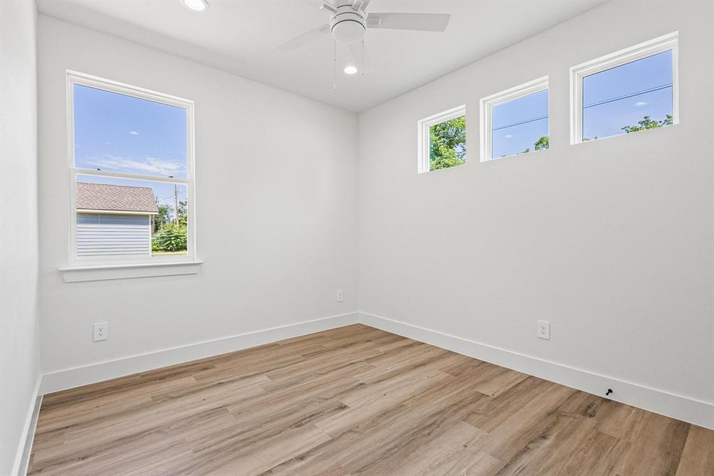 508 Florence Denison, TX 75020 - Photo 19 of 26 wooden floor in an empty room with a window