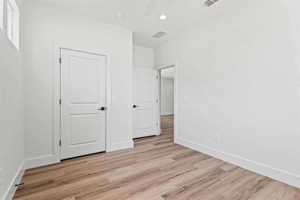 508 Florence Denison, TX 75020 - Photo 20 of 26 a view of an empty room with wooden floor