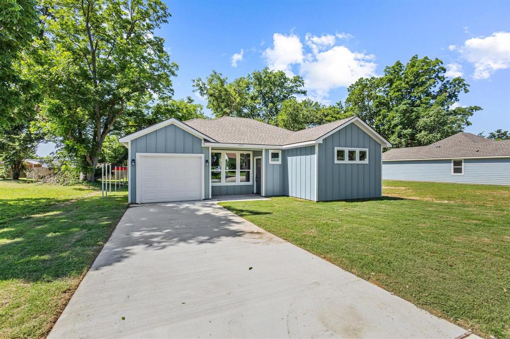 508 Florence Denison, TX 75020 - Photo 2 of 26 a view of a house with a yard