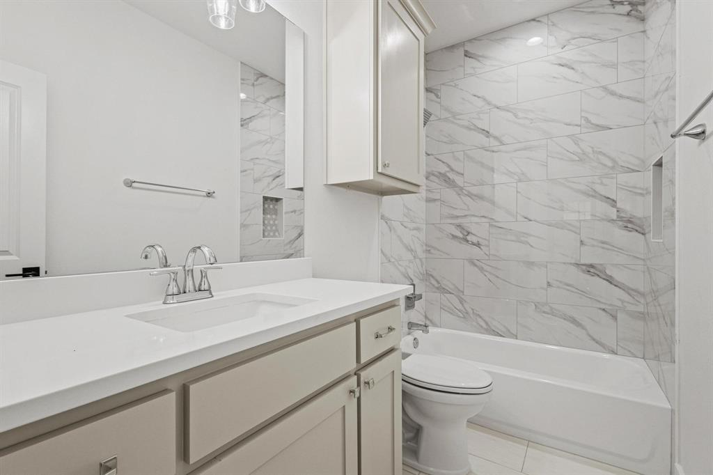508 Florence Denison, TX 75020 - Photo 21 of 26 a bathroom with a sink a toilet and shower