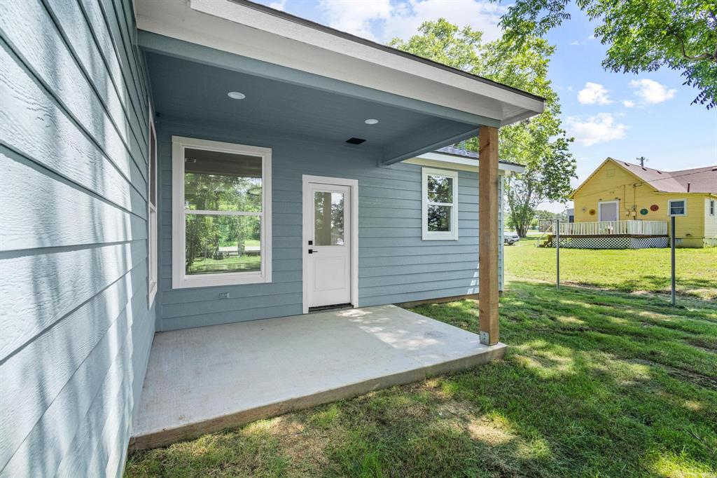 508 Florence Denison, TX 75020 - Photo 24 of 26 a view of a house with a big yard and large tree
