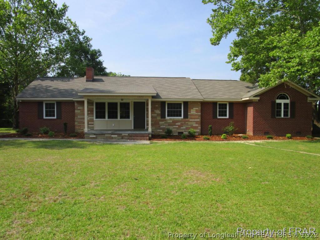 1373 Joel Road Carthage, NC 28327 - Photo 1 of 27 a front view of house with yard and green space