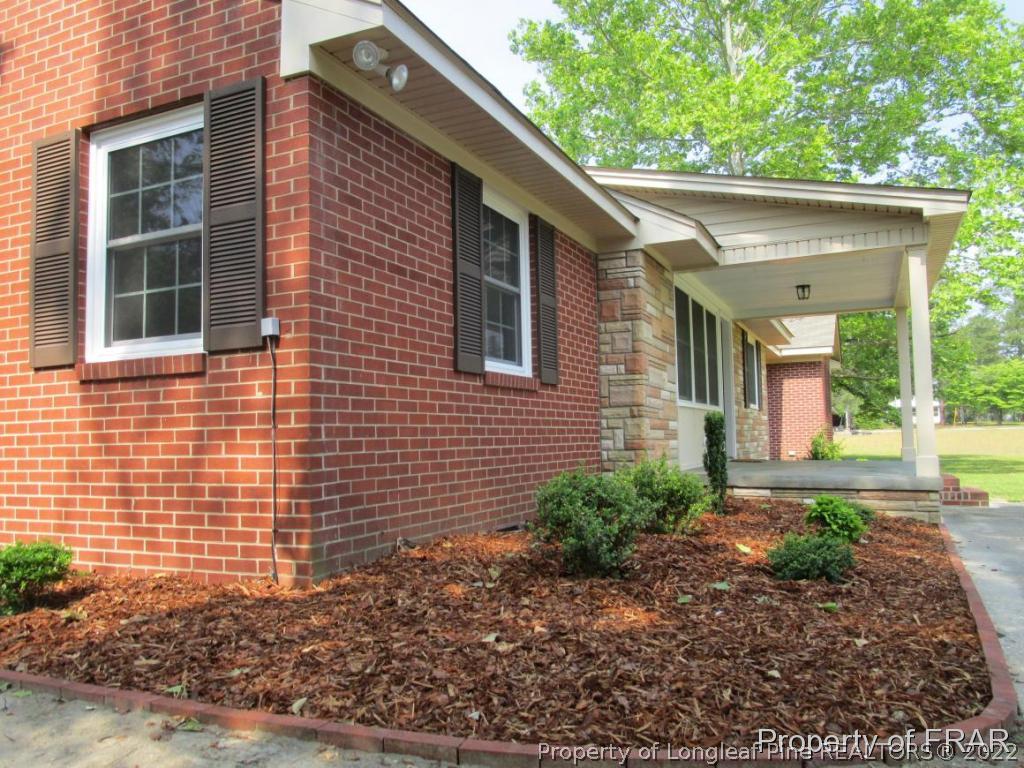 1373 Joel Road Carthage, NC 28327 - Photo 2 of 27 a front view of a house with garden