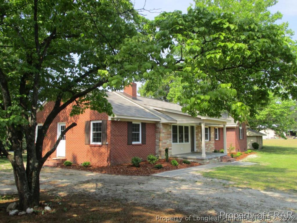 1373 Joel Road Carthage, NC 28327 - Photo 21 of 27 a front view of a house with a yard
