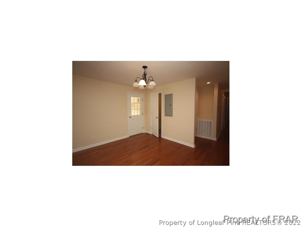 1373 Joel Road Carthage, NC 28327 - Photo 9 of 27 a open living room with a couch and chandelier