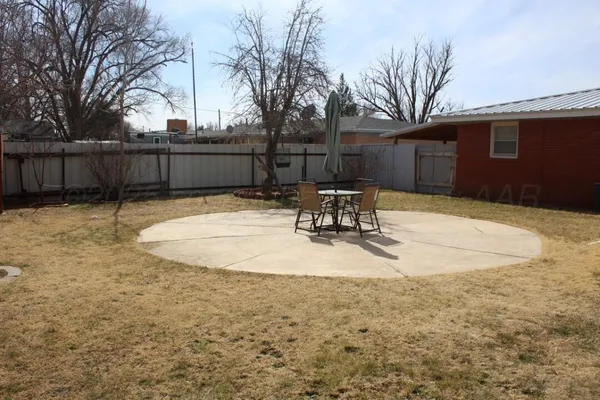 a view of a backyard of the house