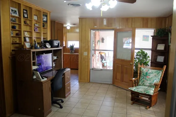 a kitchen with a refrigerator and a sink