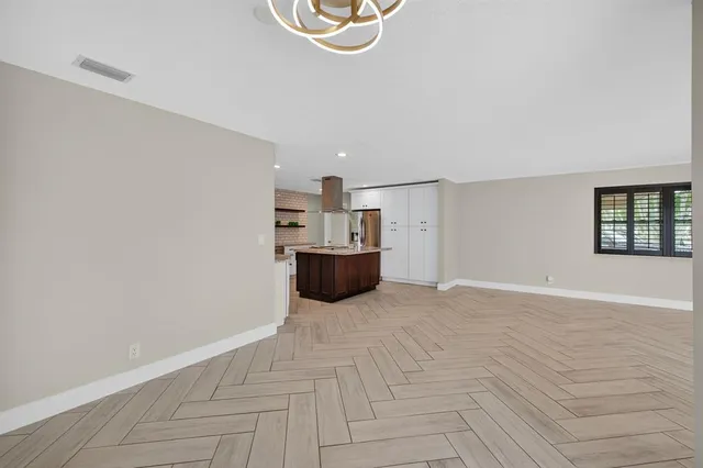 a view of a livingroom with a kitchen