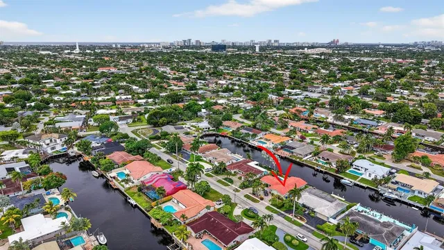 an aerial view of residential houses with outdoor space and street view
