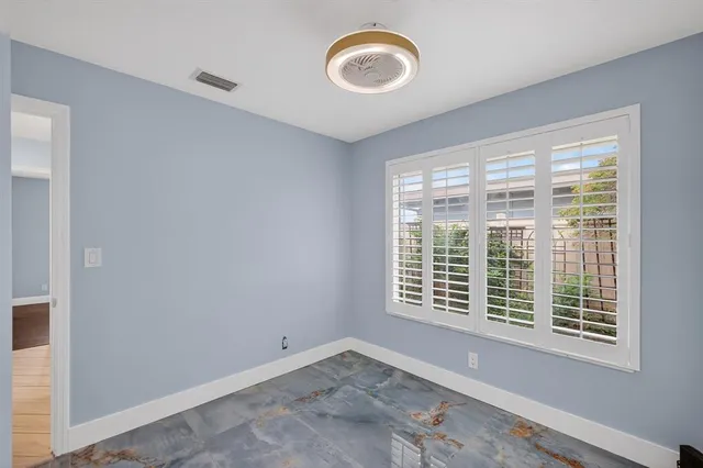 a view of a room with lots of windows and garage