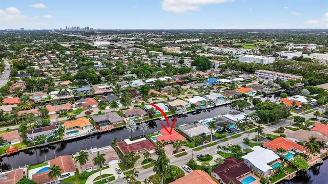 an aerial view of city and lake