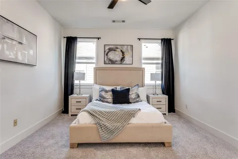 a bedroom with a bed and window