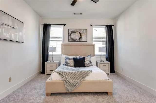 a bedroom with a bed and window