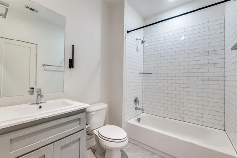 a bathroom with a sink a toilet and a bathtub