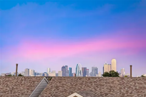 a view of a city with tall buildings in the background