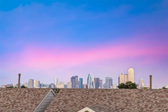 a view of a city with tall buildings in the background