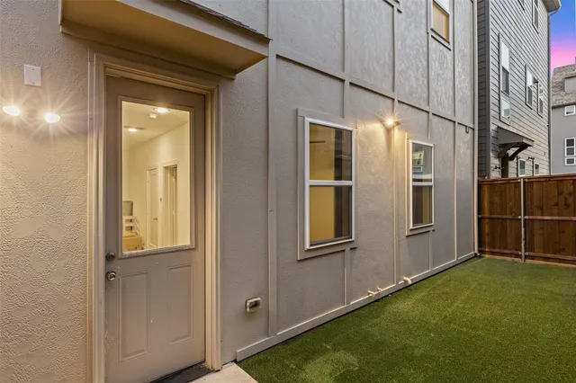 a view of swimming pool with lounge chairs in patio