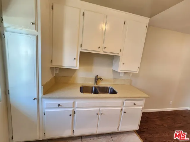 a kitchen with a sink and cabinets