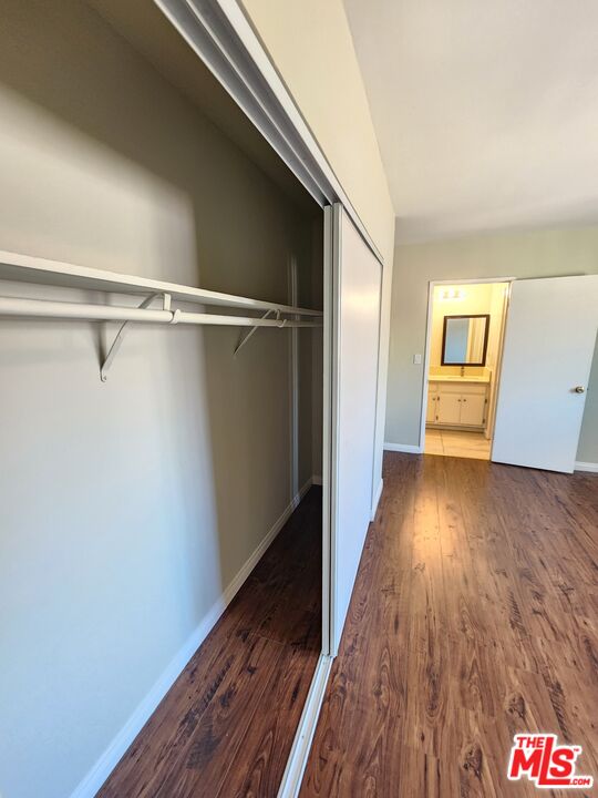 7925 Vineland Avenue, Unit 26 Los Angeles, CA 91352 - Photo 25 of 34 a view of a hallway with wooden floor