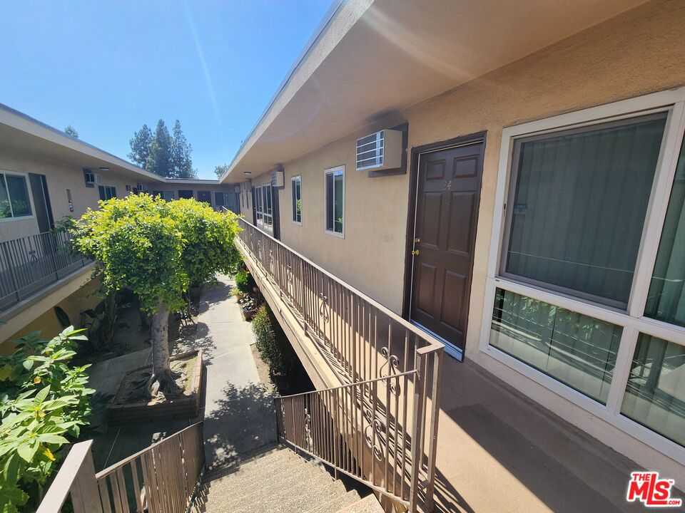 7925 Vineland Avenue, Unit 26 Los Angeles, CA 91352 - Photo 26 of 34 a view of balcony and wooden floor