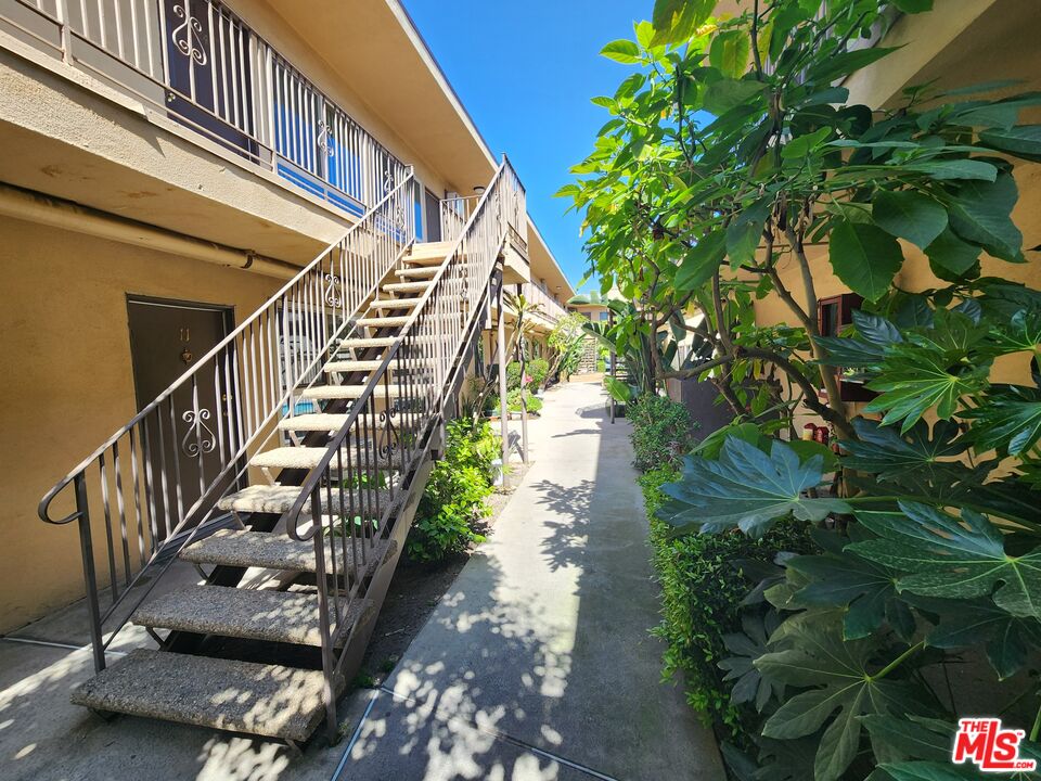 7925 Vineland Avenue, Unit 26 Los Angeles, CA 91352 - Photo 28 of 34 a view of entryway with wooden stairs