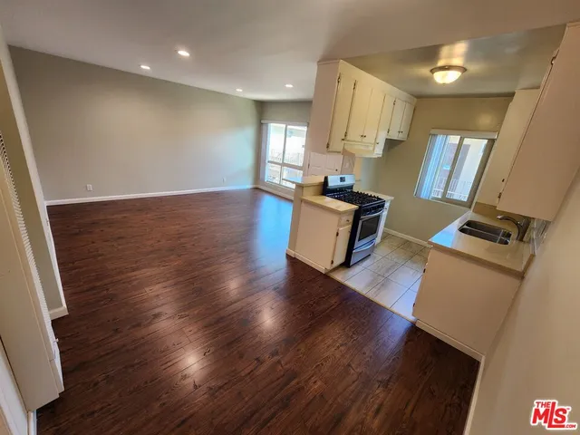 a view of kitchen and wooden floor