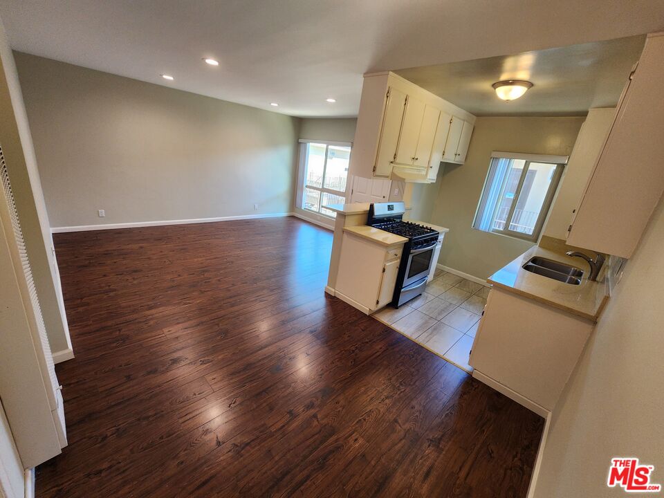 7925 Vineland Avenue, Unit 26 Los Angeles, CA 91352 - Photo 9 of 34 a view of kitchen and wooden floor