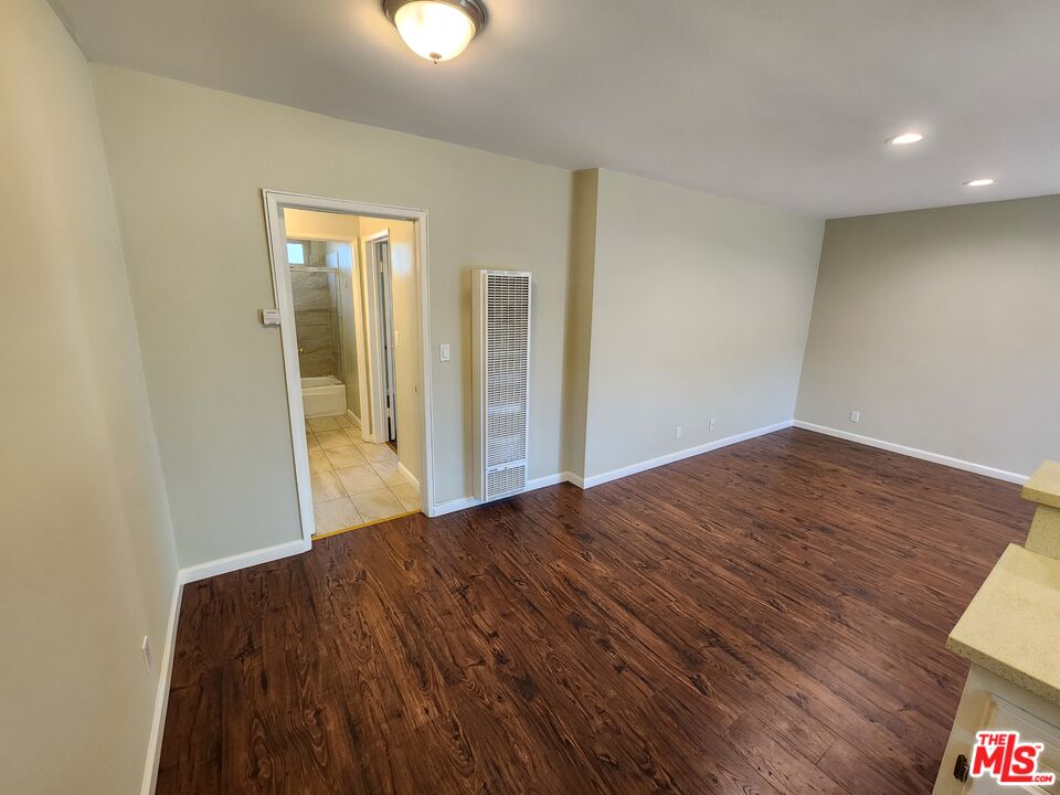 7925 Vineland Avenue, Unit 26 Los Angeles, CA 91352 - Photo 10 of 34 a view of hallway with wooden floor