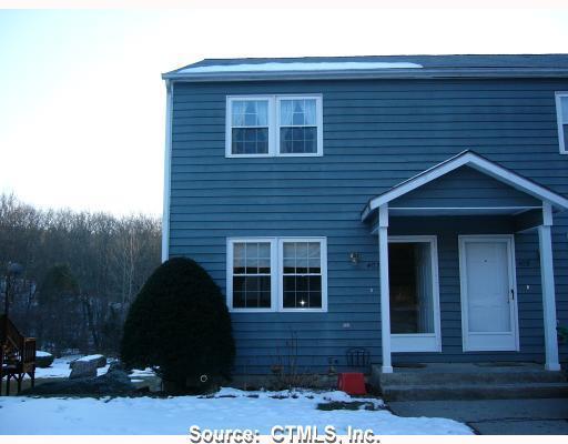 403 Linwood Cemetery Road, Unit 403 Colchester, CT 06415 - Photo 1 of 1 a front view of a house with a yard