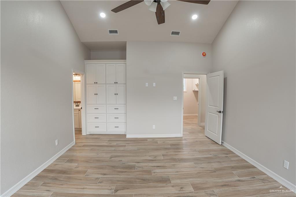 2618 Max Street Harlingen, TX 78552 - Photo 18 of 35 Interior space featuring wood-finish flooring, high ceilings with recessed lighting, and a ceiling fan