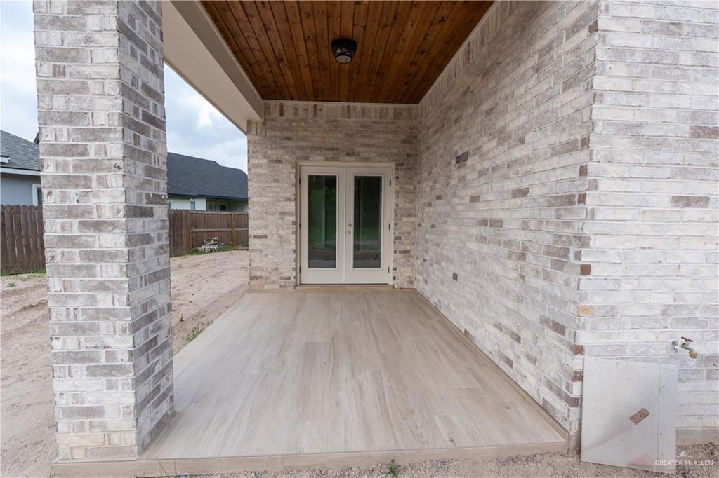 2618 Max Street Harlingen, TX 78552 - Photo 32 of 35 Covered patio featuring wood-finish flooring and a wood-paneled ceiling