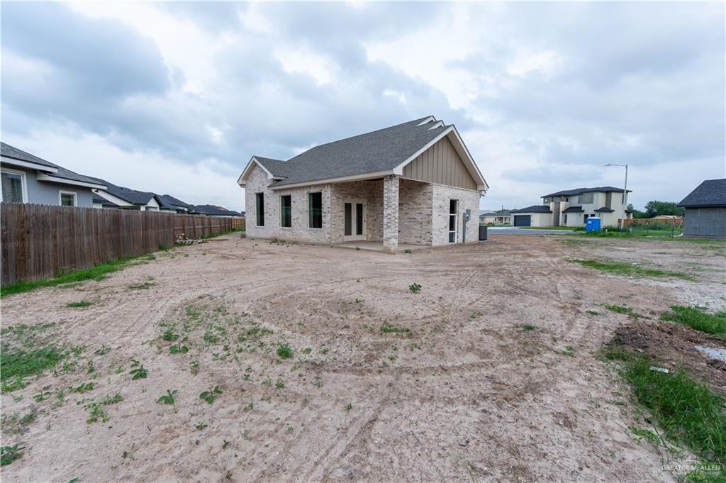 2618 Max Street Harlingen, TX 78552 - Photo 5 of 35 New construction home featuring a light-colored brick exterior and a dark shingle roof