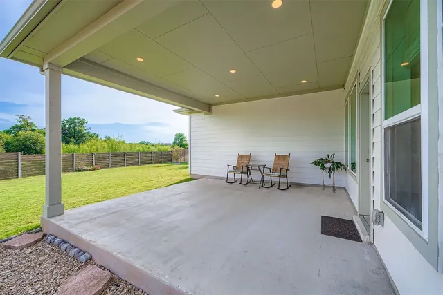a view of a room with furniture and garden