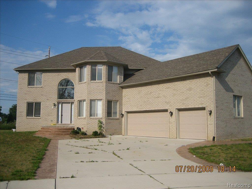 50966 Nesting Ridge Drive Macomb, MI 48044 - Photo 1 of 17 Front