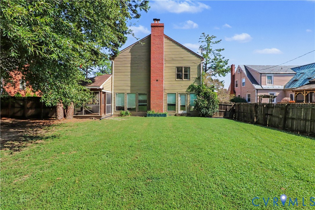 4803 Coleman Road Richmond, VA 23230 - Photo 43 of 54 Expansive backyard with a manicured lawn, screened