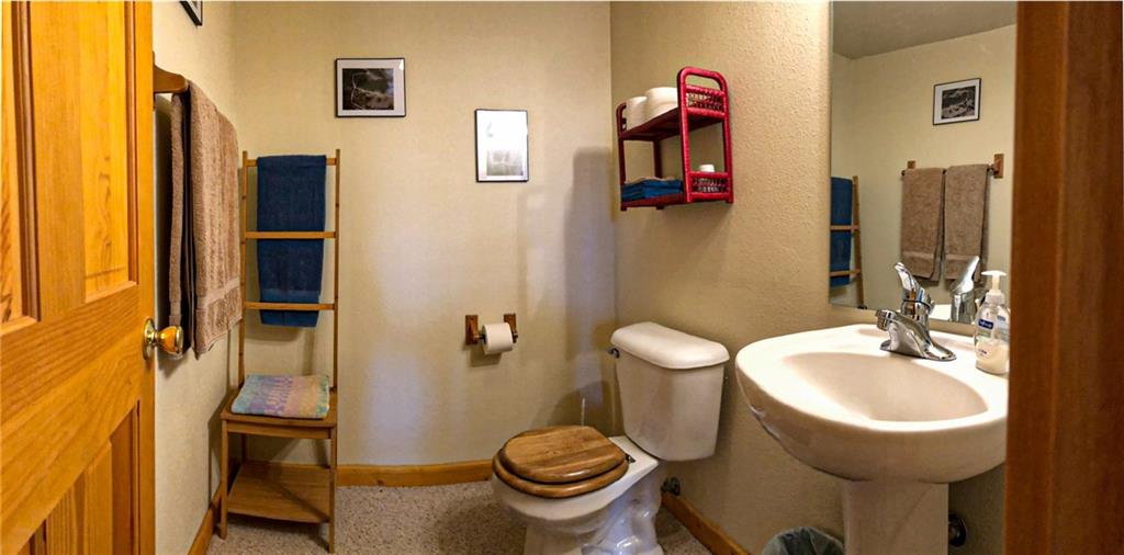 165 Sheep Ridge Road Fairplay, CO 80440 - Photo 24 of 33 a bathroom with a toilet sink and mirror