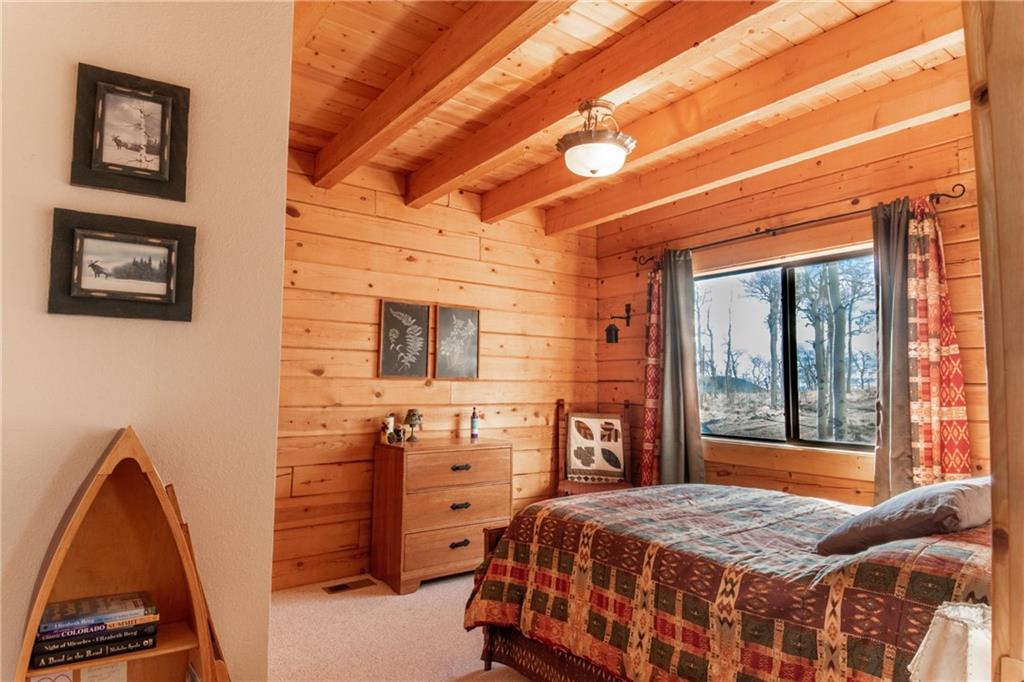 165 Sheep Ridge Road Fairplay, CO 80440 - Photo 8 of 33 a bedroom with a bed and a window